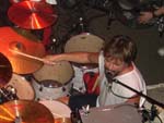 on his kit and singing